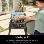 باربیکیو و اسموکر هوشمند نینجا مدل Woodfire Pro Connect XL OG951 | گریل 7 کاره بلوتوثی و ایر فرایر فضای باز {استوک} - Image 2